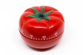 A kitchen timer in the shape of a tomato